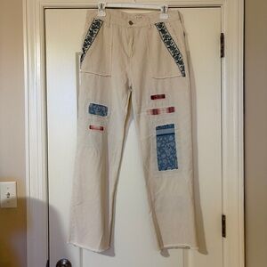 Beige Patchwork Pants with Blue and Red Accents